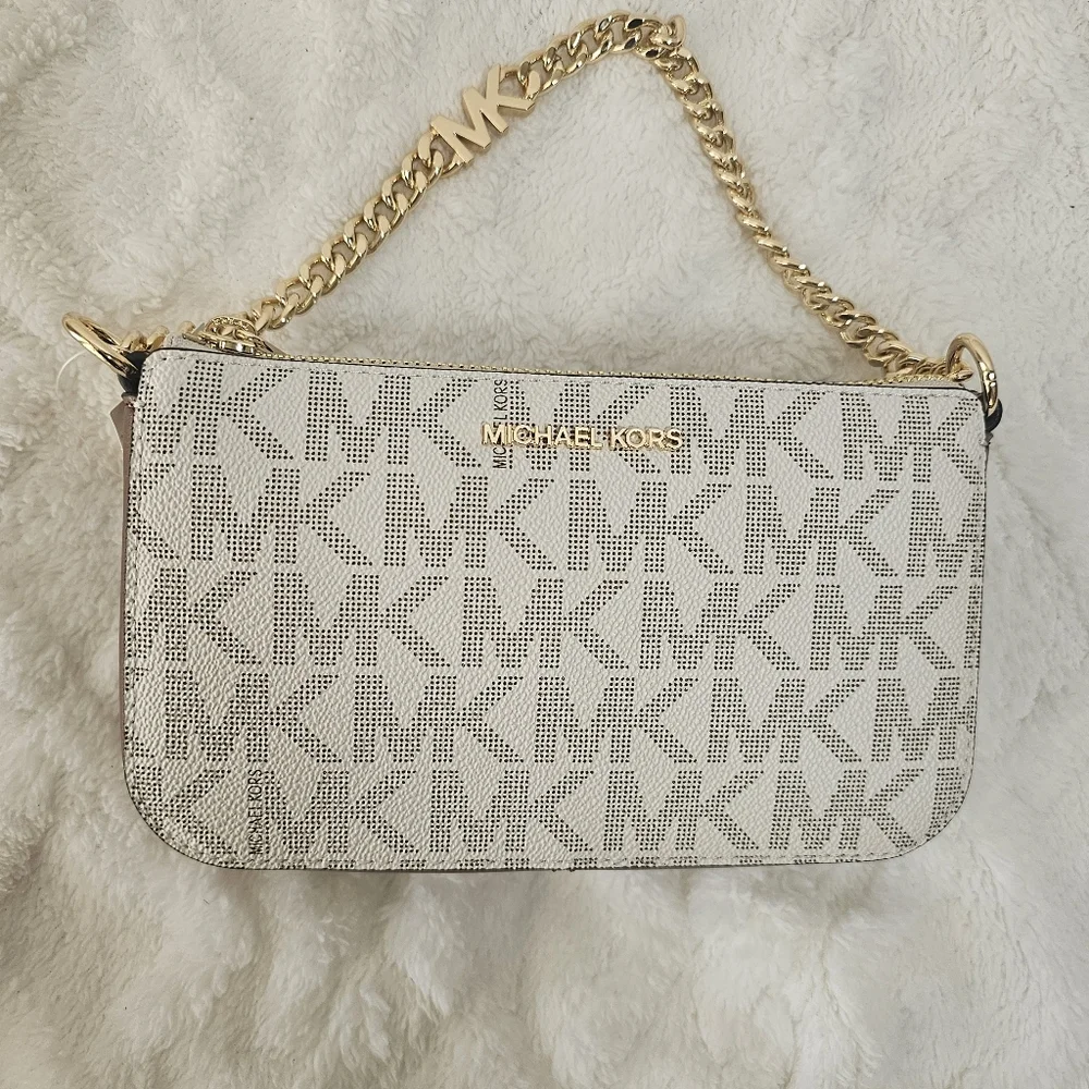 This is‎ a Michael Kors Jet Set Small Chain Pouchette in vanilla/lugg color.